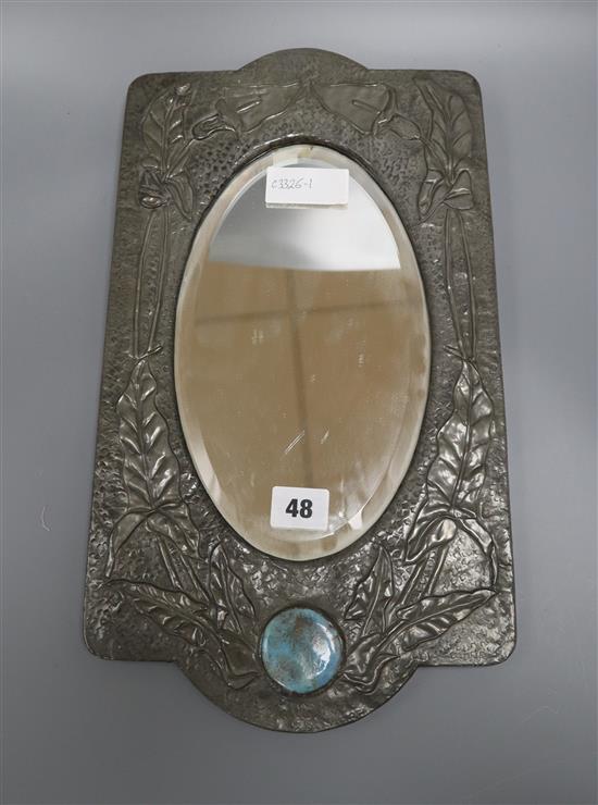 An Art Nouveau pewter overlaid wall mirror with Ruskin style plaque length 41cm